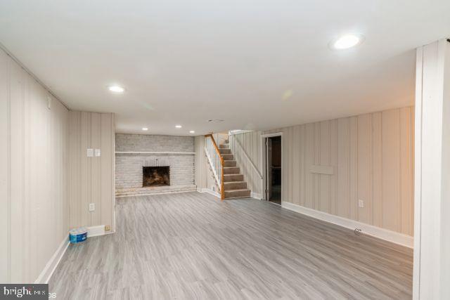126 4th Avenue Mount Ephraim, NJ 08059 - Photo 16 of 26 a view of an empty room with wooden floor fireplace and a window