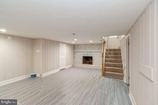 126 4th Avenue Mount Ephraim, NJ 08059 - Photo 17 of 26 a view of empty room with wooden floor and fireplace