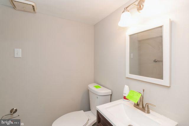 126 4th Avenue Mount Ephraim, NJ 08059 - Photo 18 of 26 a bathroom with a sink a toilet and a mirror