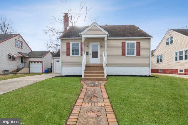 126 4th Avenue Mount Ephraim, NJ 08059 - Photo 2 of 26 a front view of a house with a garden and yard