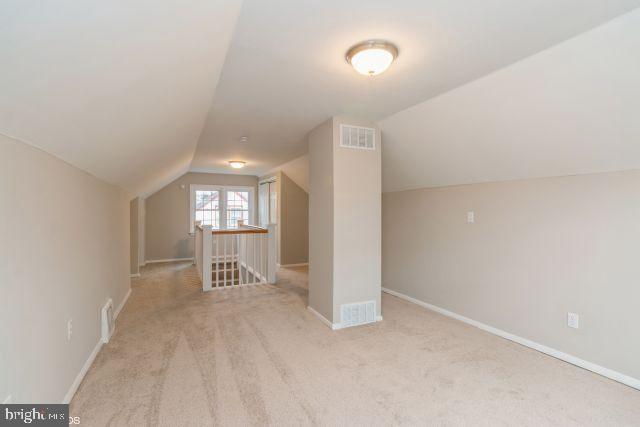 126 4th Avenue Mount Ephraim, NJ 08059 - Photo 25 of 26 a view of a hallway with wooden shelves