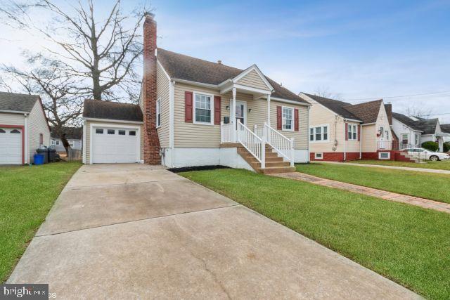126 4th Avenue Mount Ephraim, NJ 08059 - Photo 3 of 26 a front view of a house with a yard and garage
