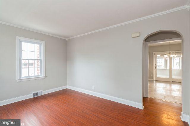 126 4th Avenue Mount Ephraim, NJ 08059 - Photo 7 of 26 an empty room with wooden floor and windows