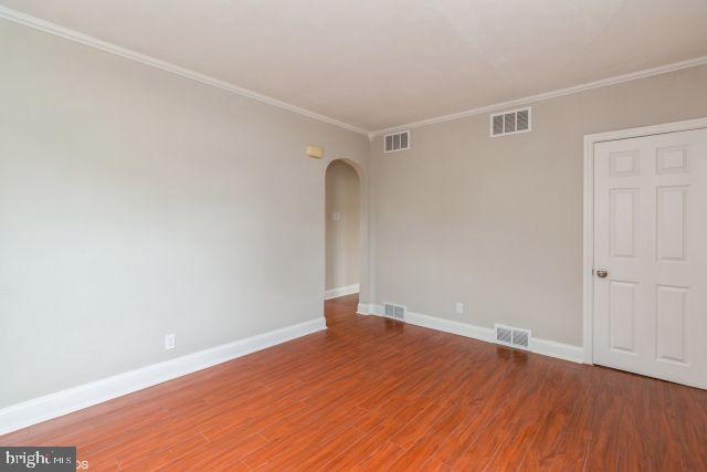 126 4th Avenue Mount Ephraim, NJ 08059 - Photo 8 of 26 a view of empty room with wooden floor and fan