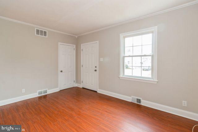 126 4th Avenue Mount Ephraim, NJ 08059 - Photo 9 of 26 an empty room with wooden floor and windows