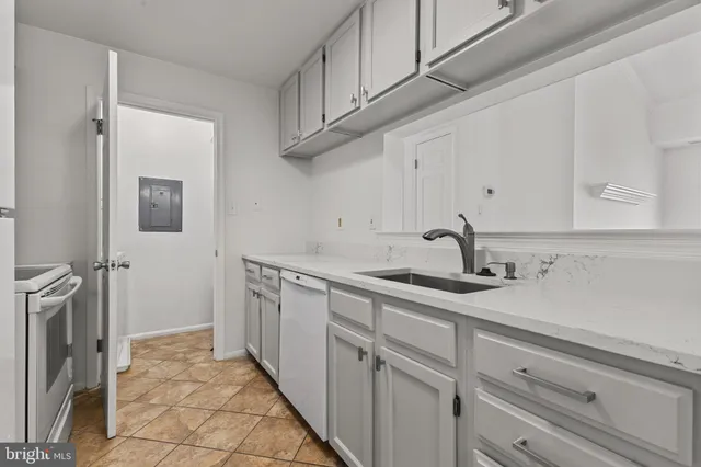 a kitchen with a sink and cabinets