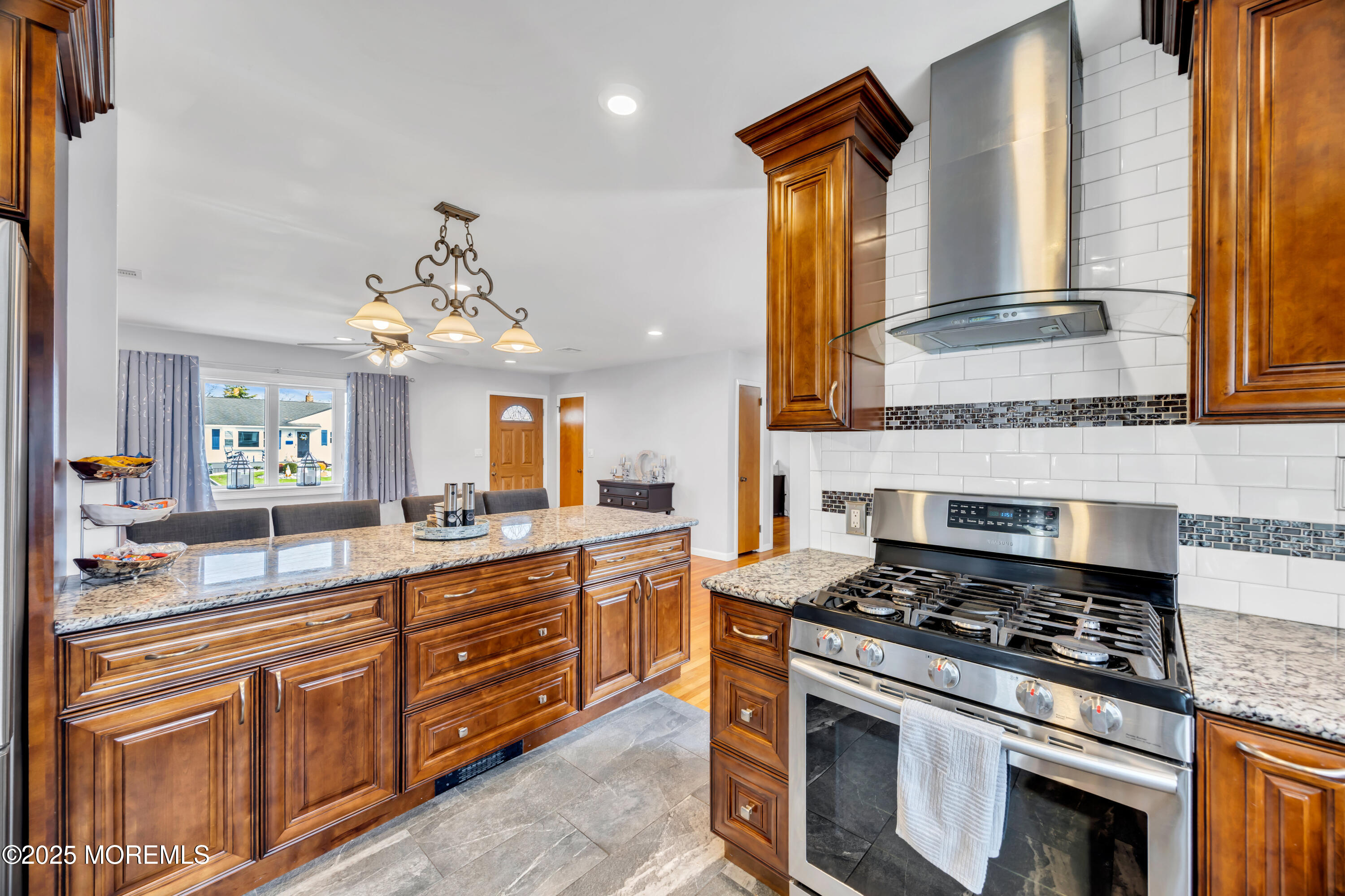 308 Green Tree Road Brick, NJ 08724 - Photo 17 of 58 a kitchen with stainless steel appliances granite countertop a stove a sink and a microwave