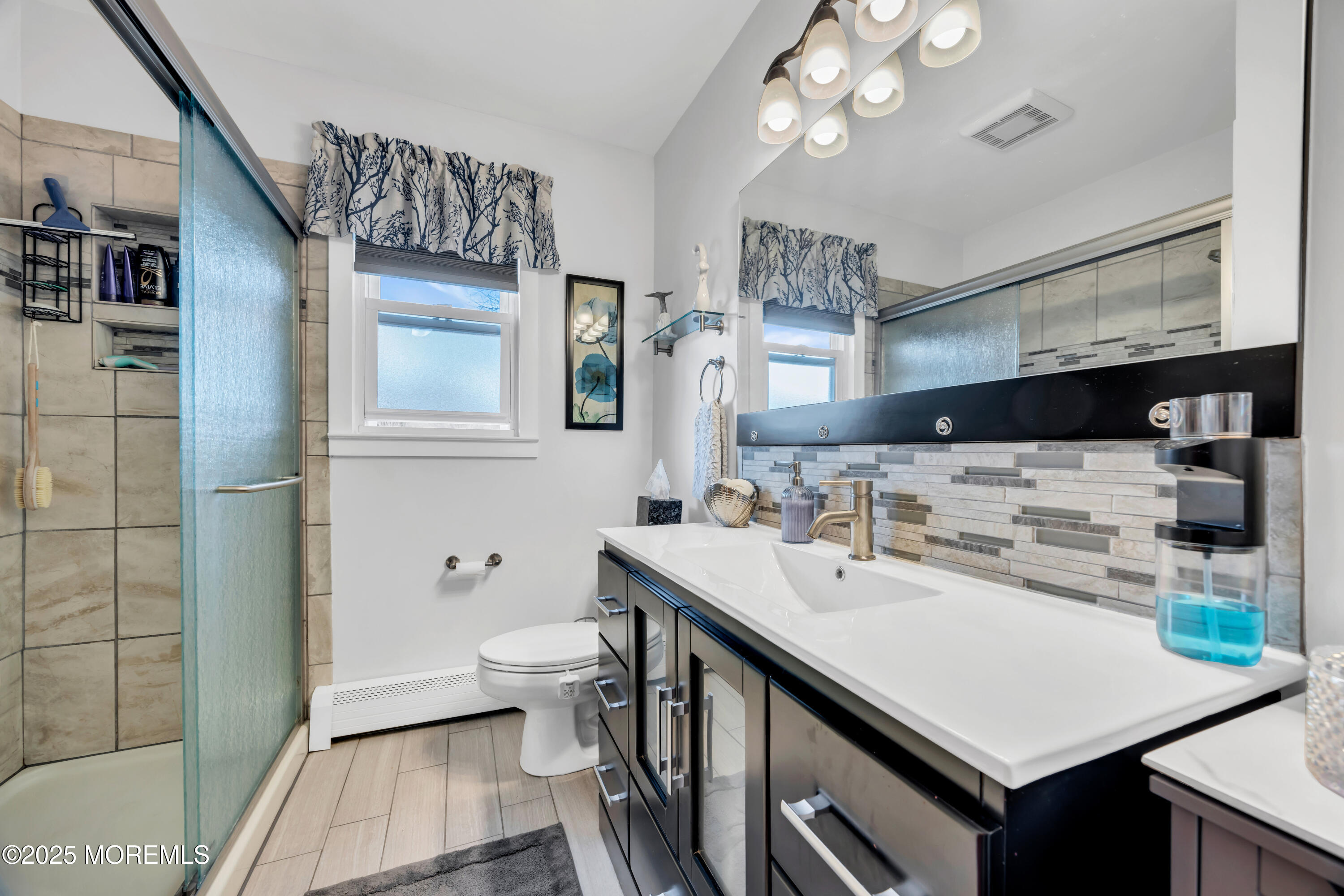 308 Green Tree Road Brick, NJ 08724 - Photo 29 of 58 a bathroom with a sink a toilet and shower