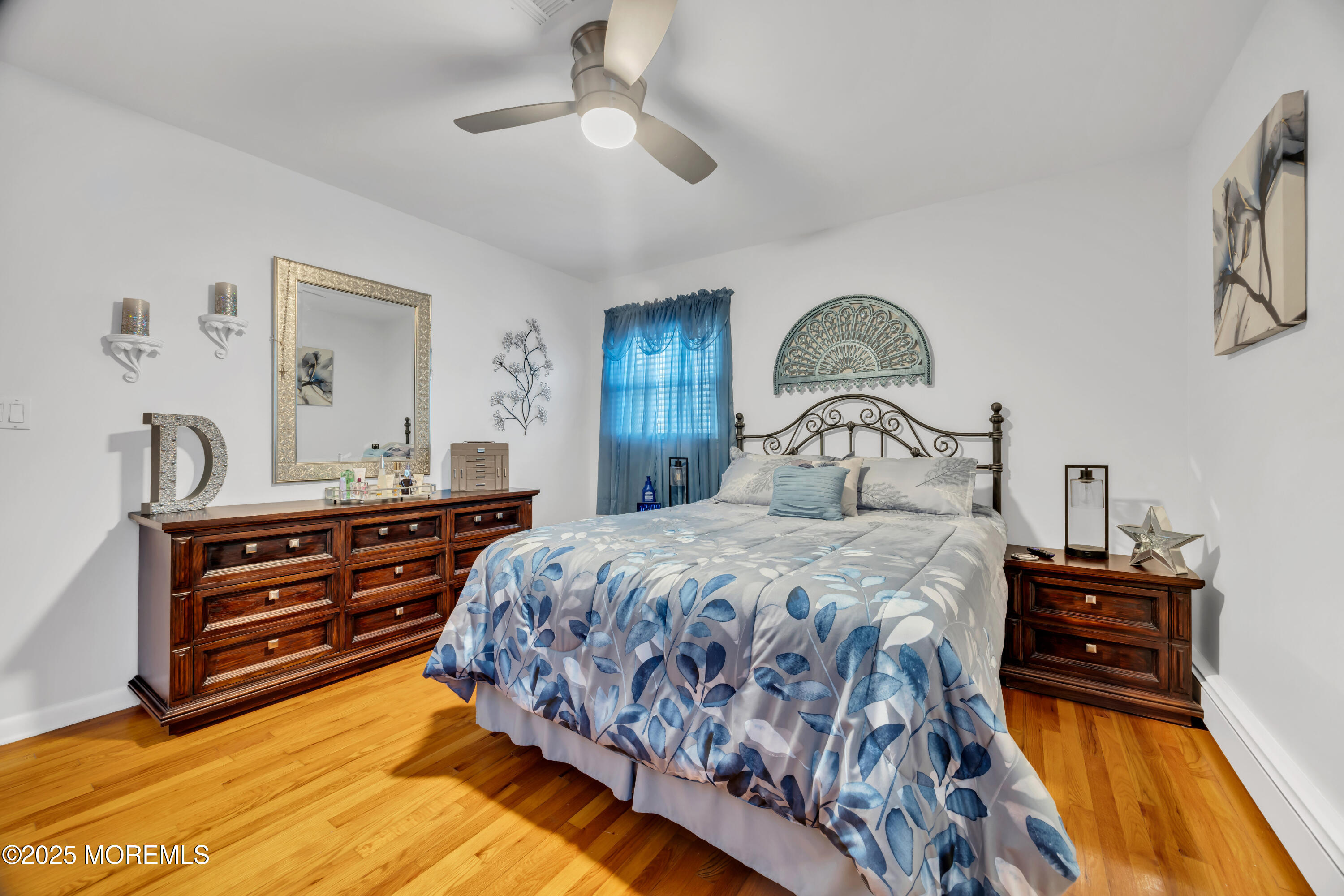 308 Green Tree Road Brick, NJ 08724 - Photo 31 of 58 a bedroom with a bed and a dresser with mirror