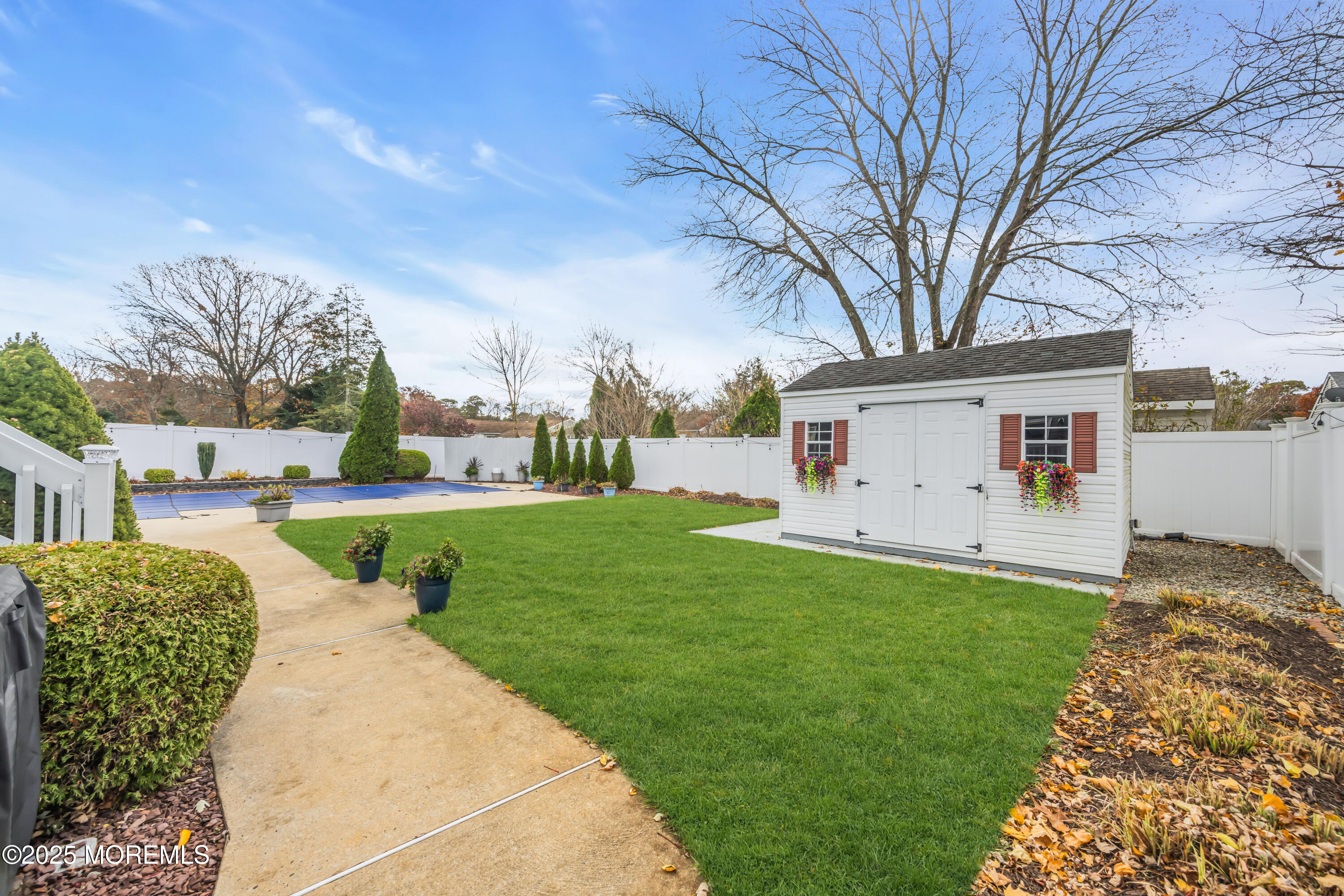 308 Green Tree Road Brick, NJ 08724 - Photo 34 of 58 a front view of a house with garden