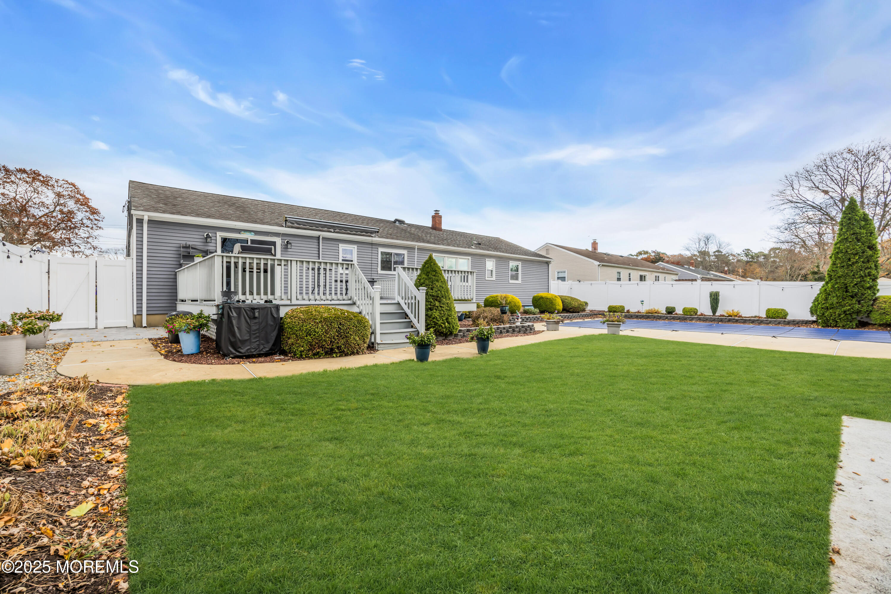 308 Green Tree Road Brick, NJ 08724 - Photo 35 of 58 a view of a house with a backyard porch and sitting area