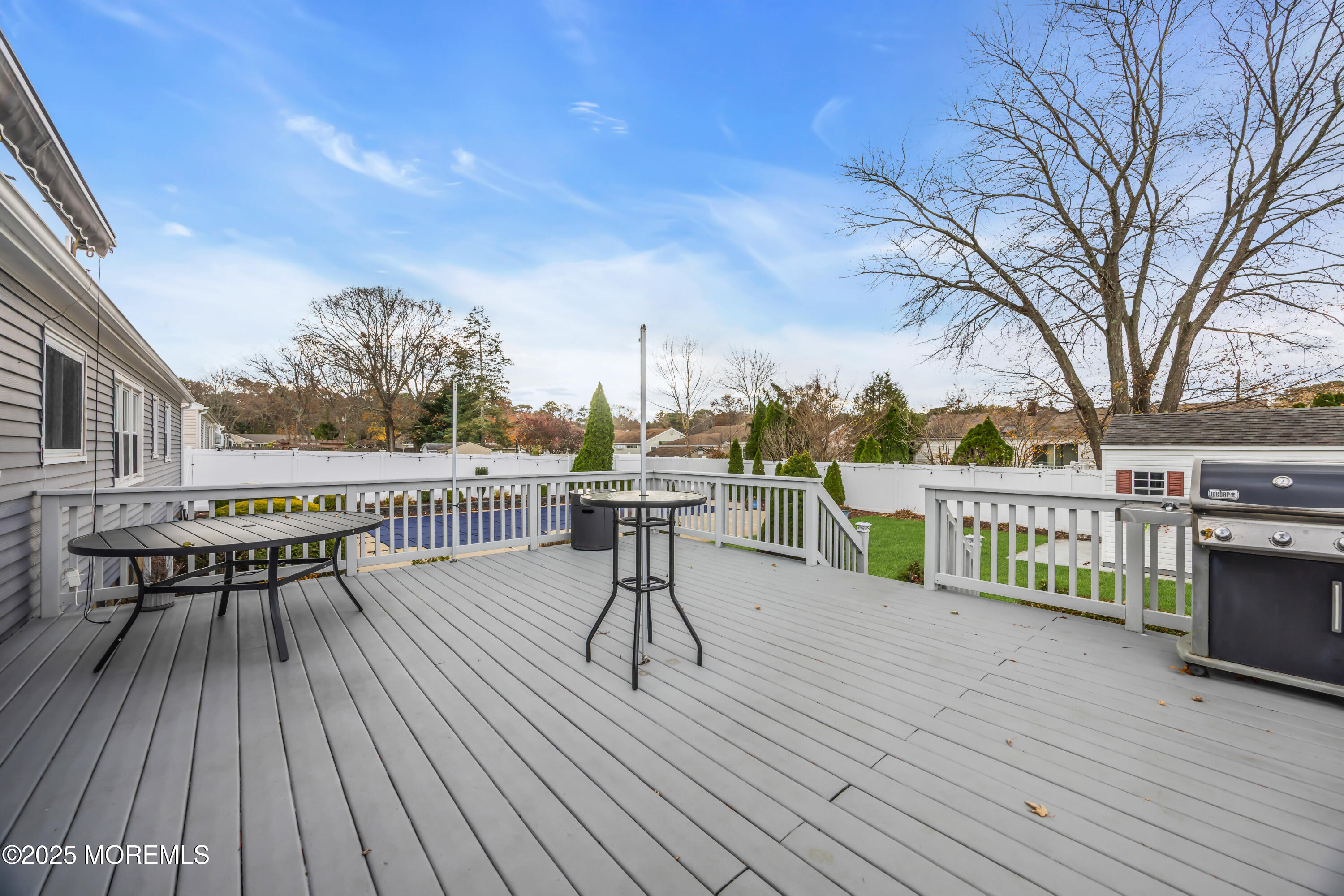 308 Green Tree Road Brick, NJ 08724 - Photo 40 of 58 a view of a roof deck with table and chairs a barbeque with wooden floor and fence