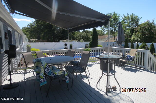 308 Green Tree Road Brick, NJ 08724 - Photo 54 of 58 a view of a patio with a table chairs and a table