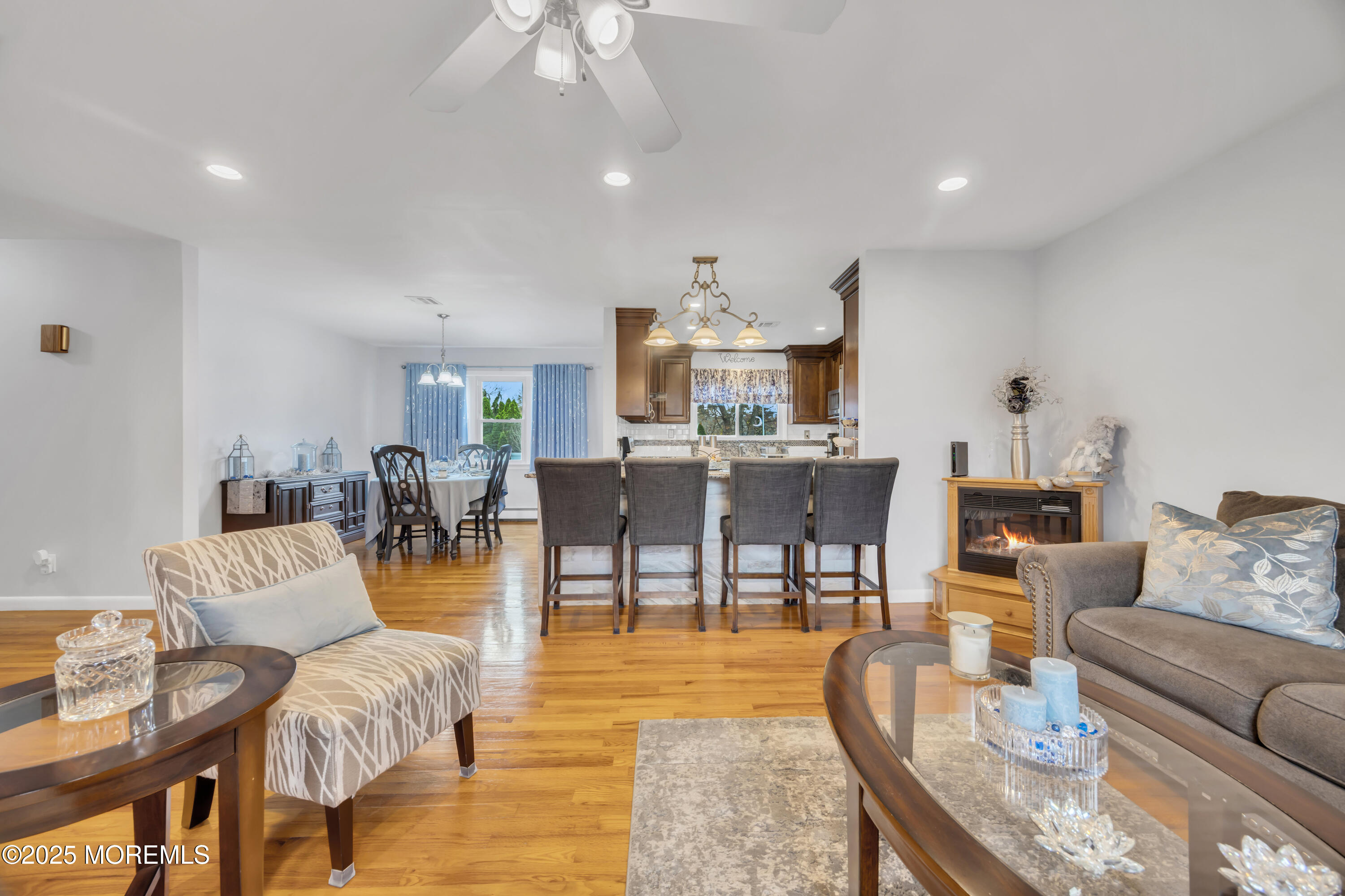 308 Green Tree Road Brick, NJ 08724 - Photo 10 of 58 a living room with furniture and a dining area with kitchen view