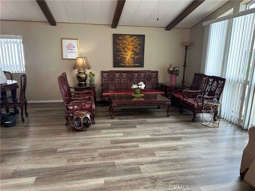 27701 Murrieta Road, Unit 268 Menifee, CA 92586 - Photo 3 of 24 a living room with furniture and a fireplace