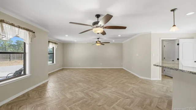 a view of an empty room with a window