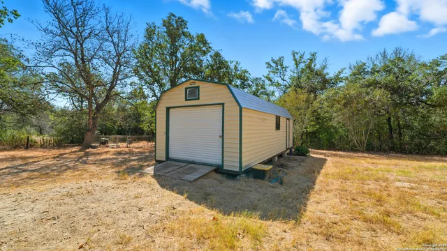 a view of a backyard of the house