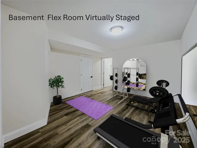 a front view of a house with a yard and potted plants