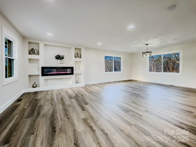 a kitchen with stainless steel appliances a stove sink and cabinets