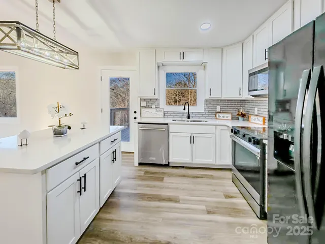 a bathroom with a granite countertop sink a mirror and a vanity