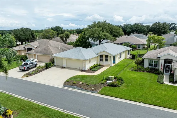 an aerial view of residential houses and outdoor space
