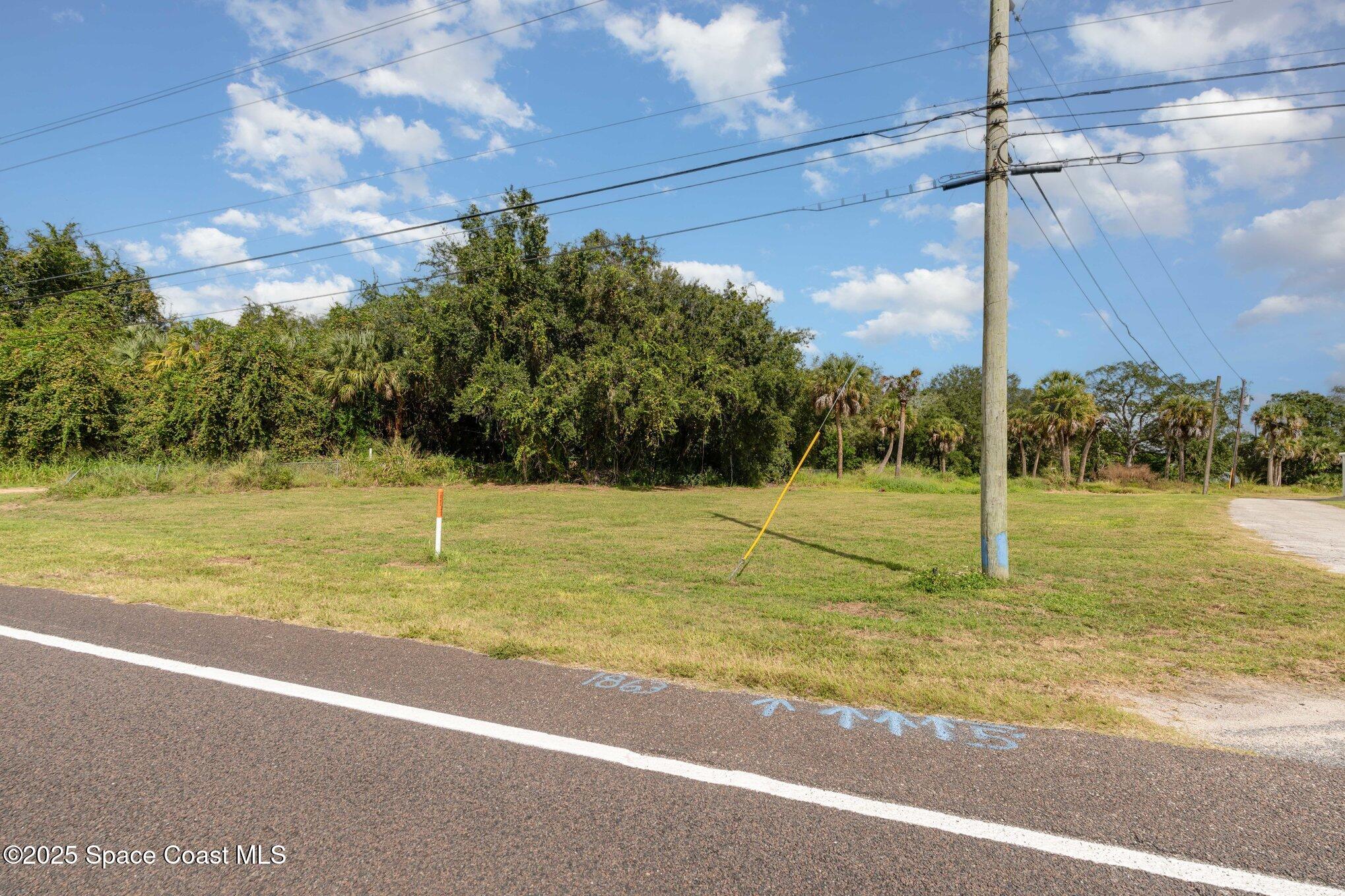 1863 Rockledge Drive Rockledge, FL 32955 - Photo 24 of 43 a view of a swimming pool and a yard