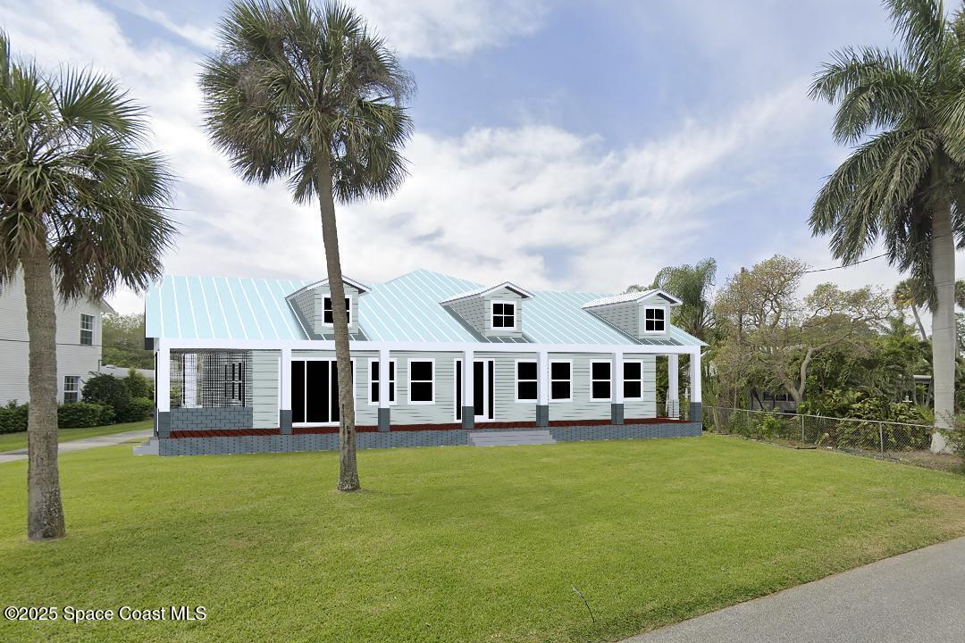 1863 Rockledge Drive Rockledge, FL 32955 - Photo 32 of 57 a front view of a house with a garden and lake view
