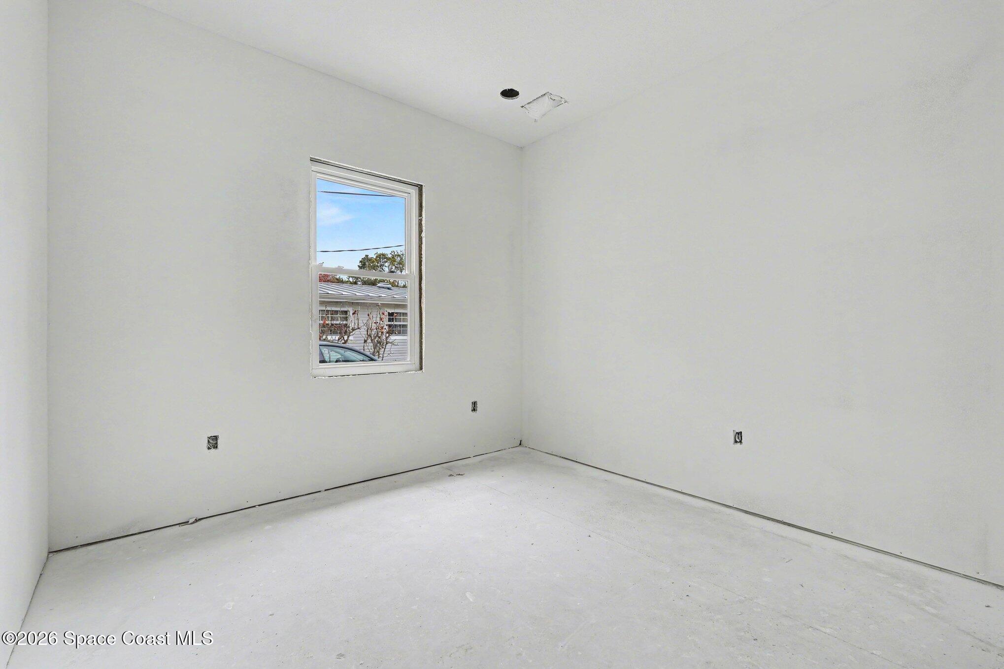 1863 Rockledge Drive Rockledge, FL 32955 - Photo 55 of 57 a view of an empty room with a window