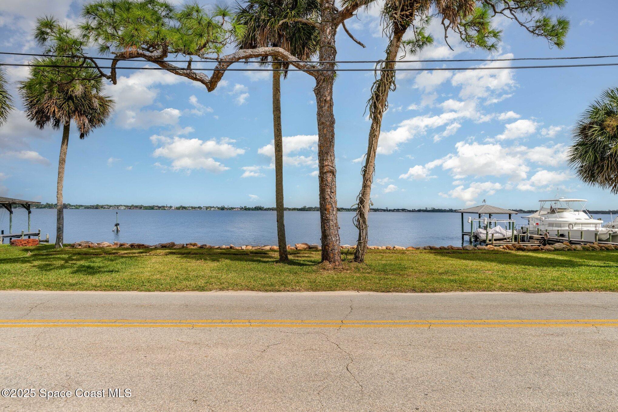 1863 Rockledge Drive Rockledge, FL 32955 - Photo 9 of 43 a view of a yard and a ocean view