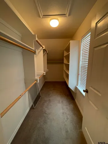 a view of a house with yard and a garage