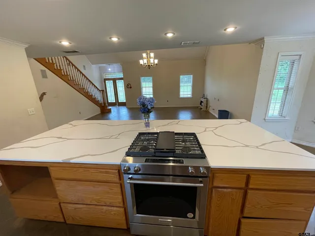 a kitchen with a stove and a sink
