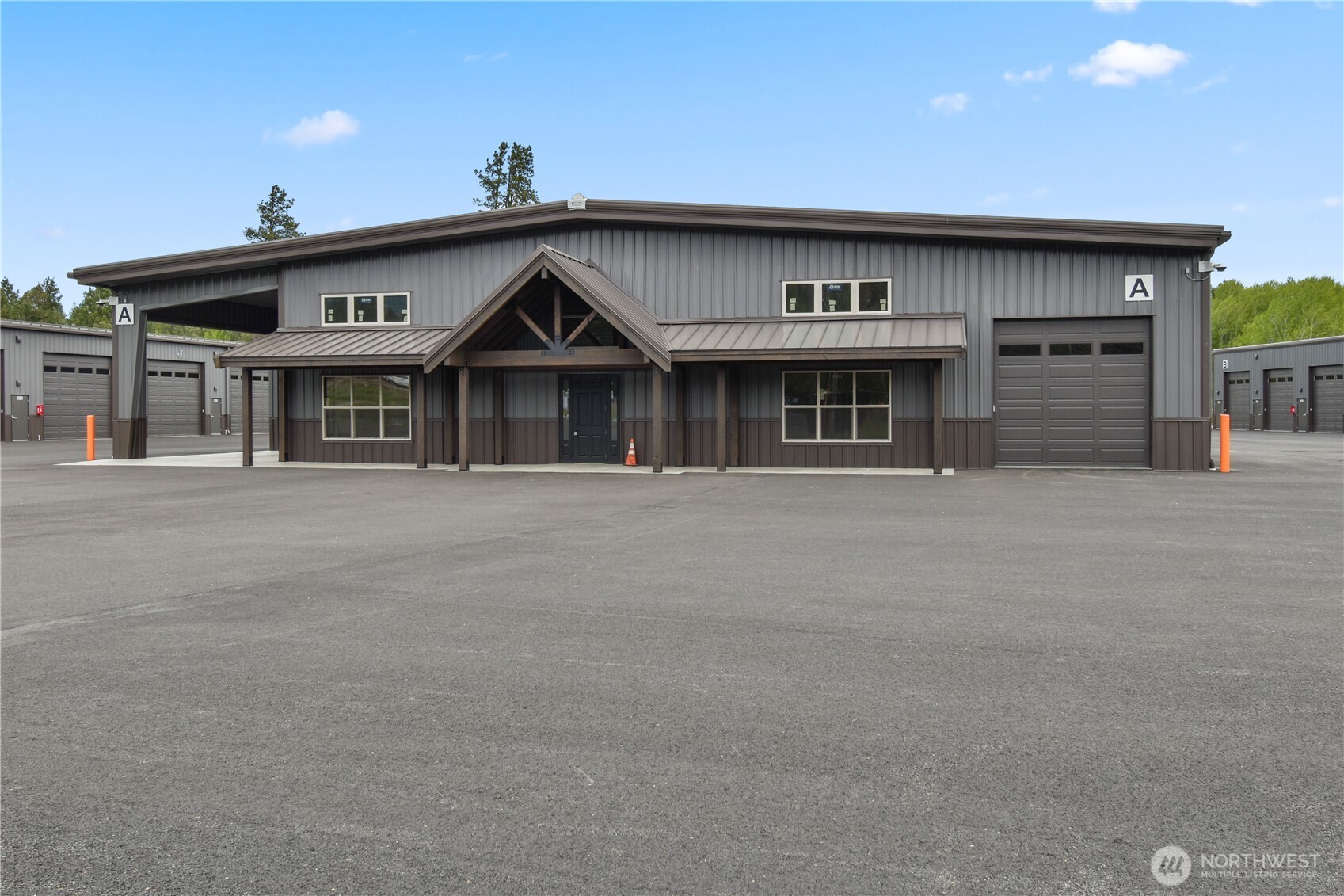 4081 Highway 970, Unit D7 Cle Elum, WA 98922 - Photo 12 of 27 a front view of a house with large windows