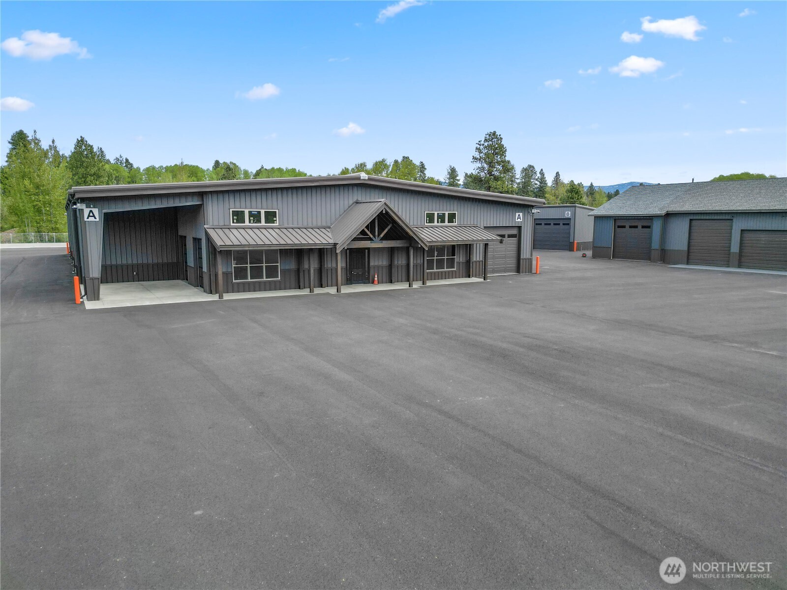 4081 Highway 970, Unit D7 Cle Elum, WA 98922 - Photo 9 of 27 a view of a house with a yard and potted plants