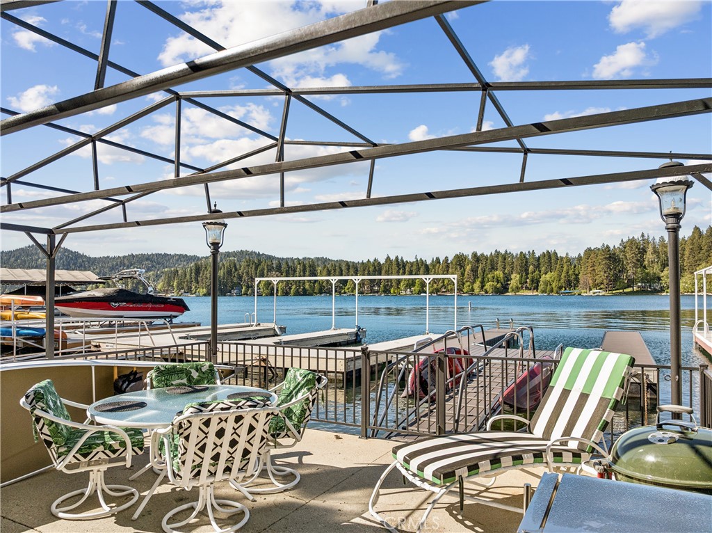 28019 North Shore Road Lake Arrowhead, CA 92352 - Photo 29 of 30 a view of a balcony with table and chairs