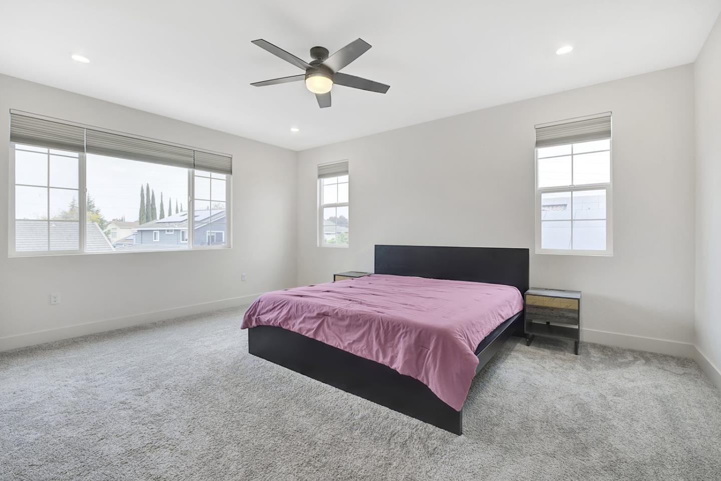 5161 Maniago Way Antioch, CA 94531 - Photo 32 of 42 a bedroom with a bed chandelier and a window