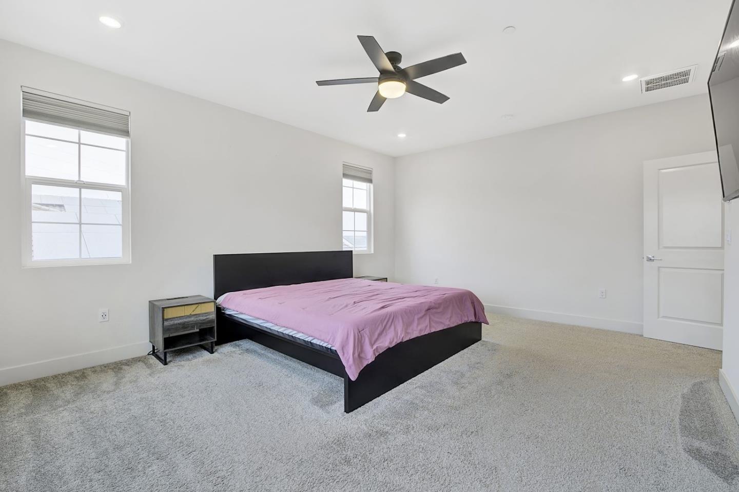 5161 Maniago Way Antioch, CA 94531 - Photo 34 of 42 a bedroom with a bed and a chandelier