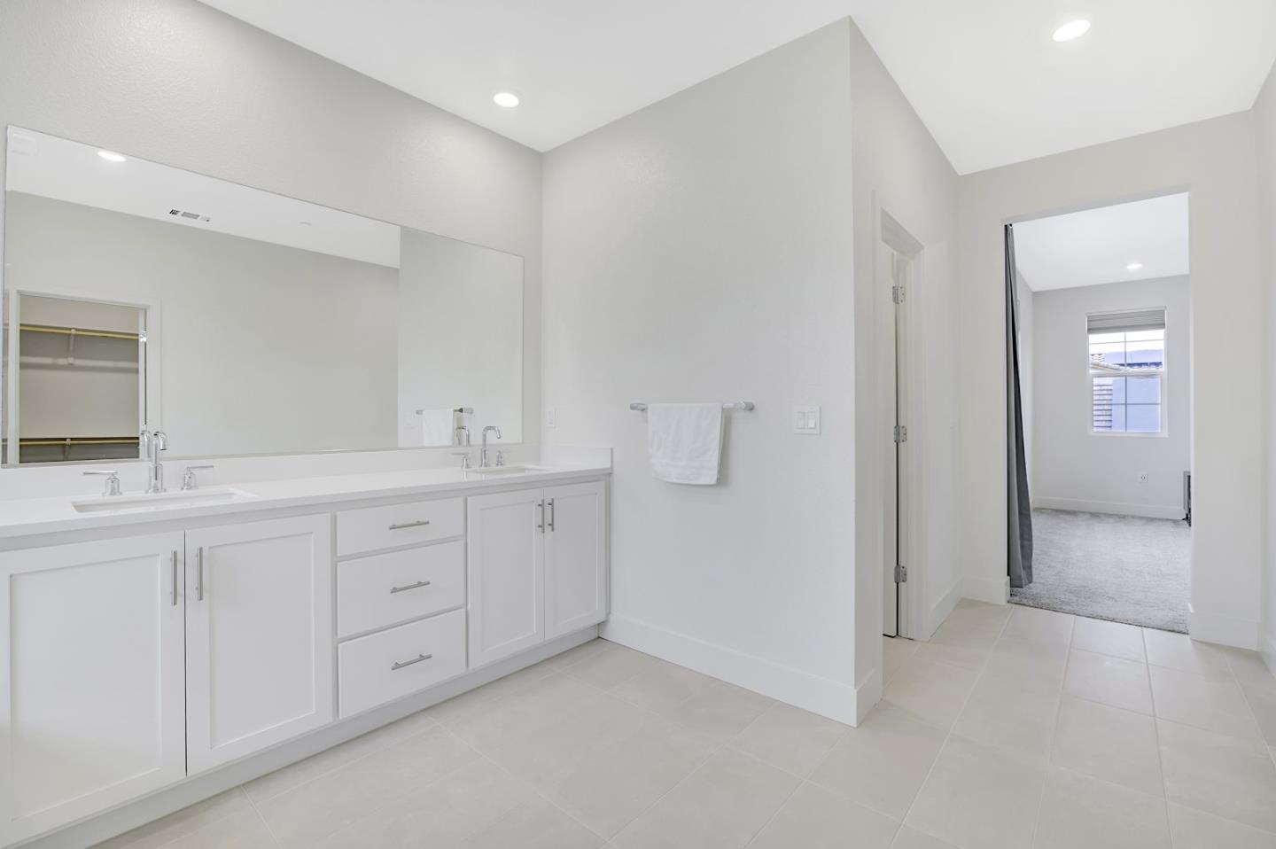 5161 Maniago Way Antioch, CA 94531 - Photo 37 of 42 a spacious bathroom with 2 sink and a mirror