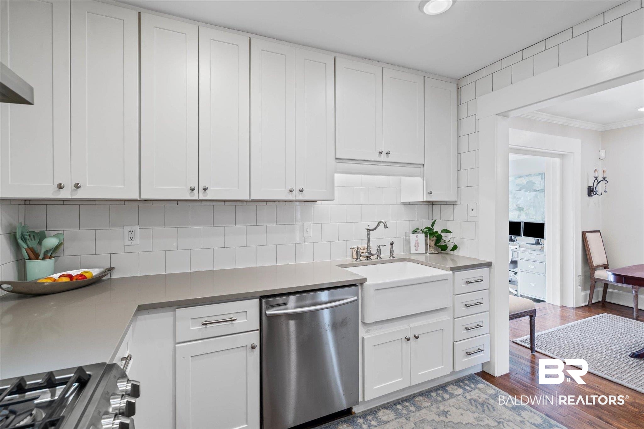 4310 The Cedars Avenue Mobile, AL 36608 - Photo 10 of 32 Kitchen with stainless steel appliances, white cabinetry, backsplash, and dark wood finished floors