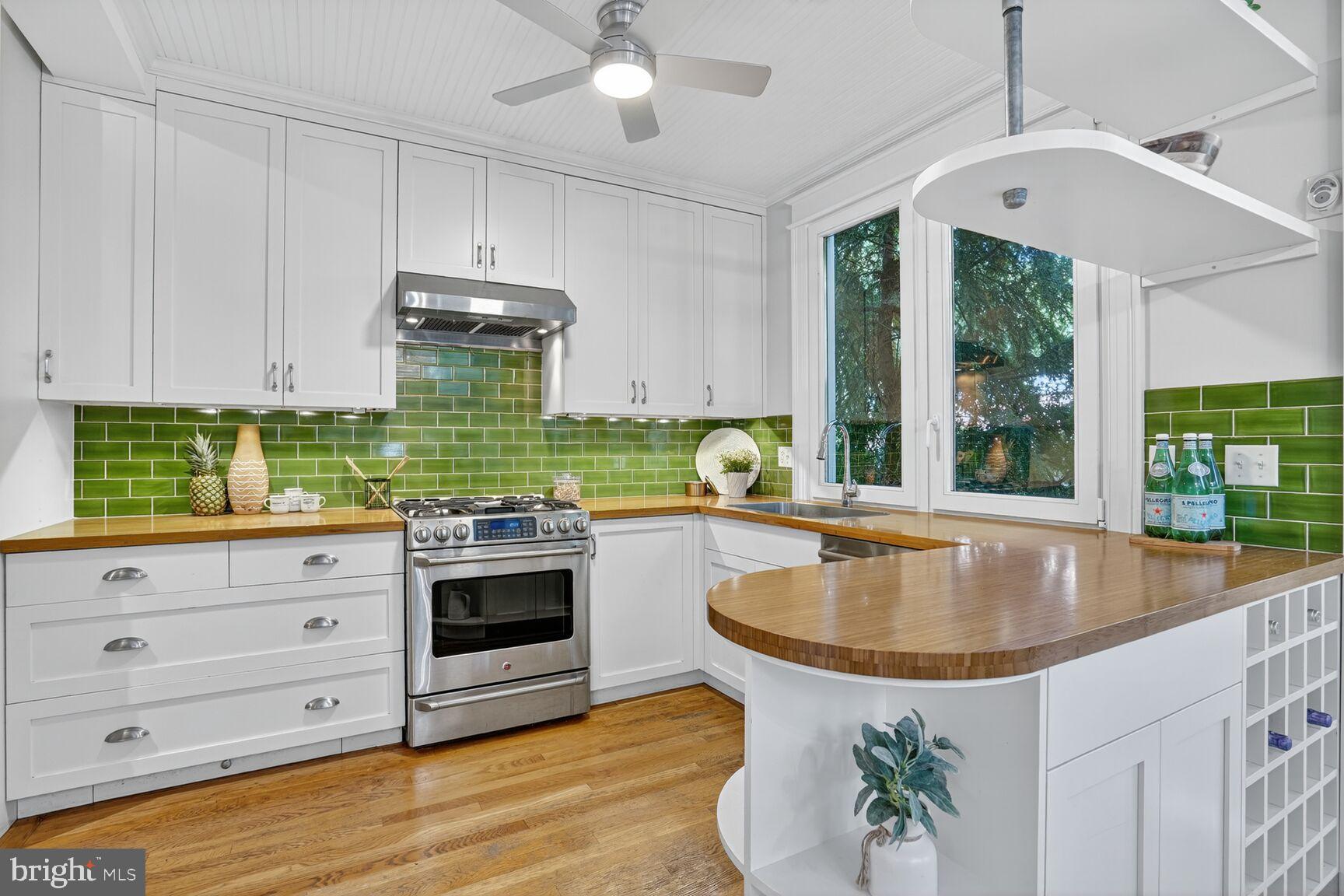 4302 37th Street Northwest Washington, DC 20008 - Photo 14 of 39 Bright kitchen with green tile accents.