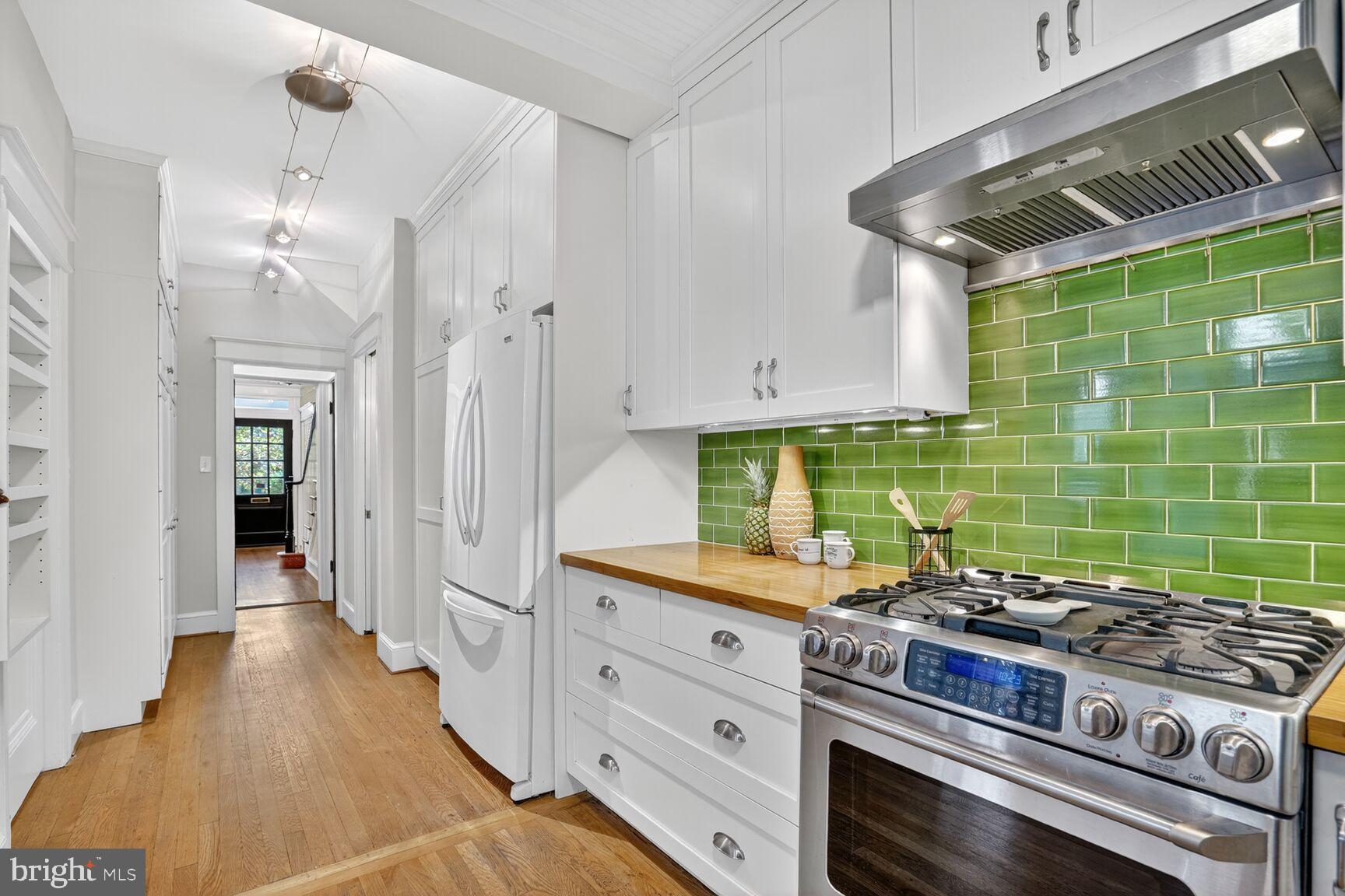 4302 37th Street Northwest Washington, DC 20008 - Photo 16 of 39 Charming kitchen with vibrant green backsplash.