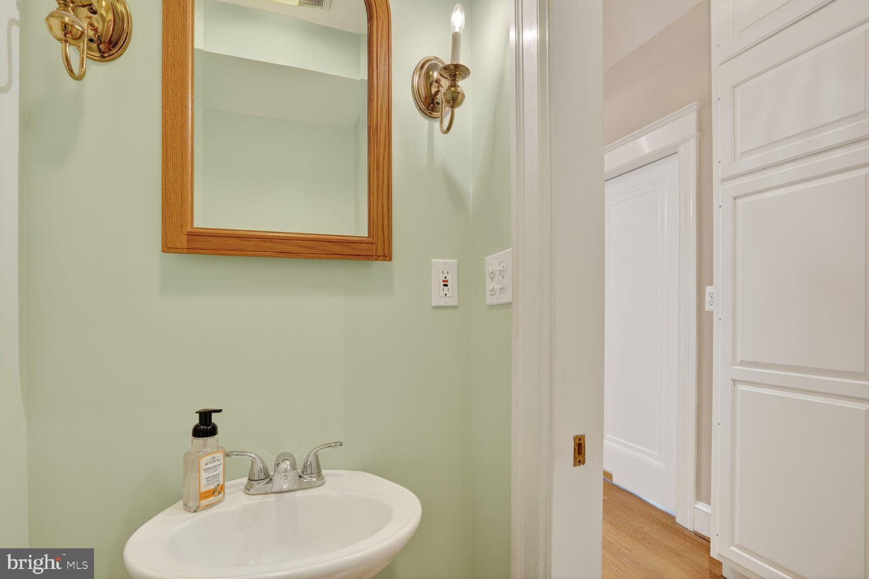 4302 37th Street Northwest Washington, DC 20008 - Photo 20 of 39 Charming powder room with fresh mint hues.