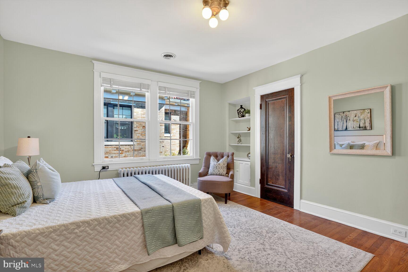 4302 37th Street Northwest Washington, DC 20008 - Photo 25 of 39 Serene bedroom with soft green hues.