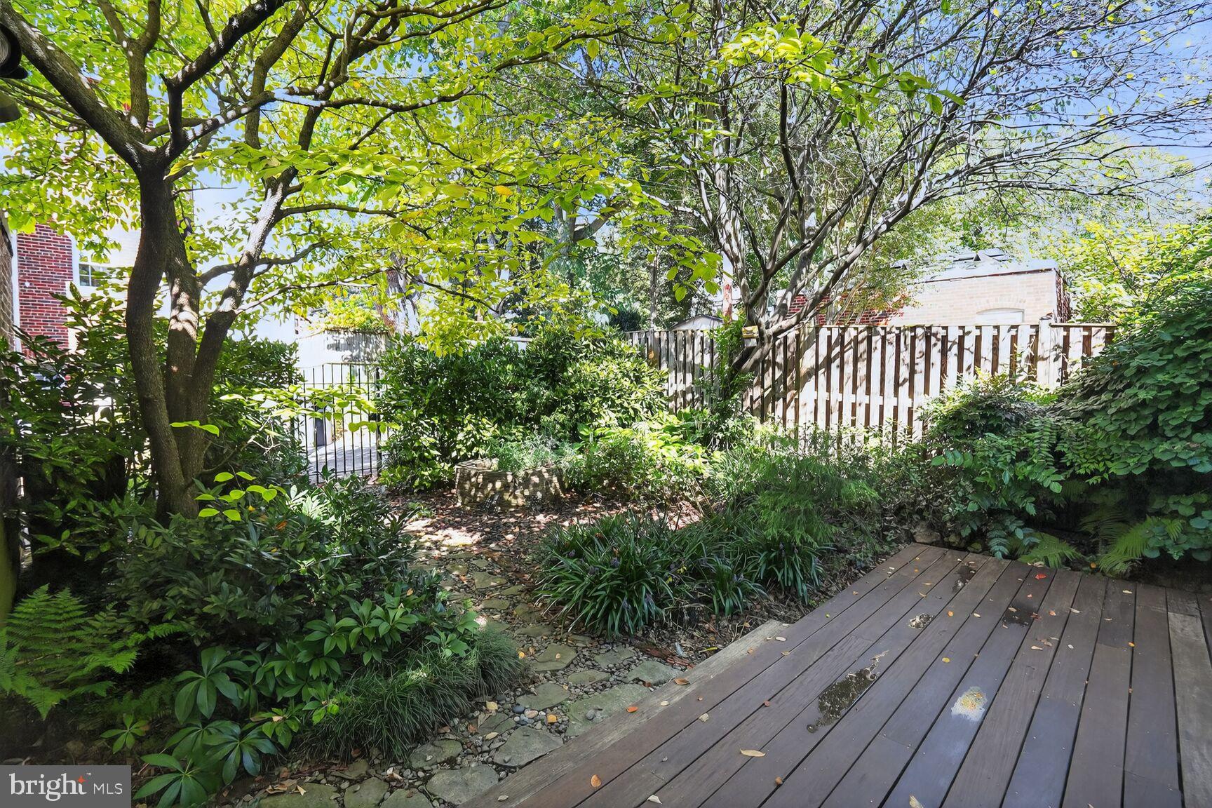 4302 37th Street Northwest Washington, DC 20008 - Photo 33 of 39 Lush garden retreat with wooden deck.