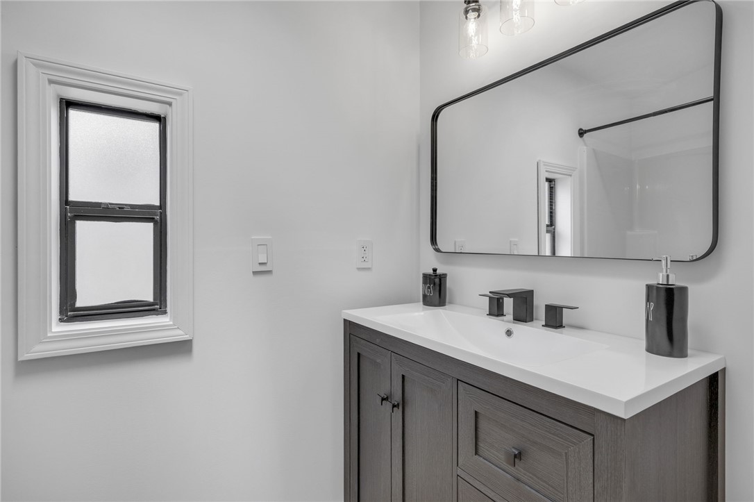 1230 Melton Road, Unit 30 West Union, SC 29696 - Photo 22 of 42 A refined bathroom featuring a contemporary vanity with a sleek dark wood finish and modern fixtures.
