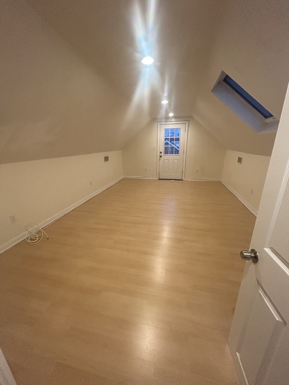 36 Hunting Street, Unit 2 Cambridge, MA 02141 - Photo 13 of 19 an empty room with a empty space and windows