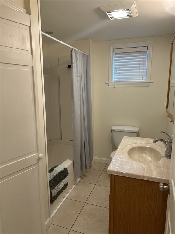 36 Hunting Street, Unit 2 Cambridge, MA 02141 - Photo 16 of 19 a bathroom with a sink toilet and shower