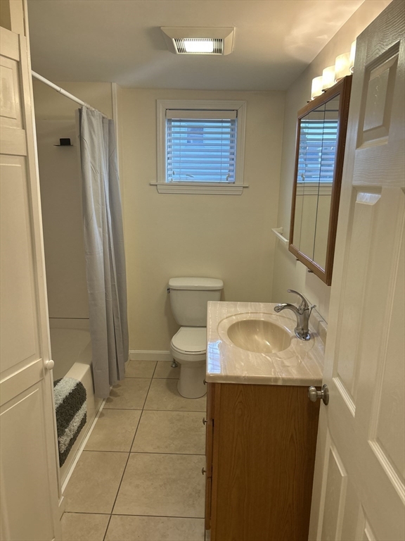 36 Hunting Street, Unit 2 Cambridge, MA 02141 - Photo 17 of 19 a bathroom with a sink toilet and shower