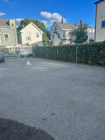 a view of a house with a yard and garage