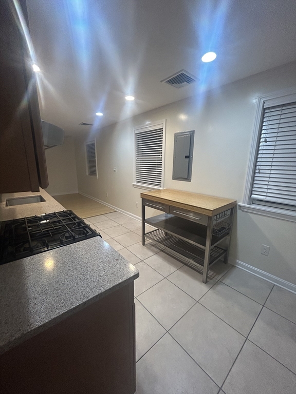 36 Hunting Street, Unit 2 Cambridge, MA 02141 - Photo 2 of 19 a stove top oven sitting inside of a kitchen