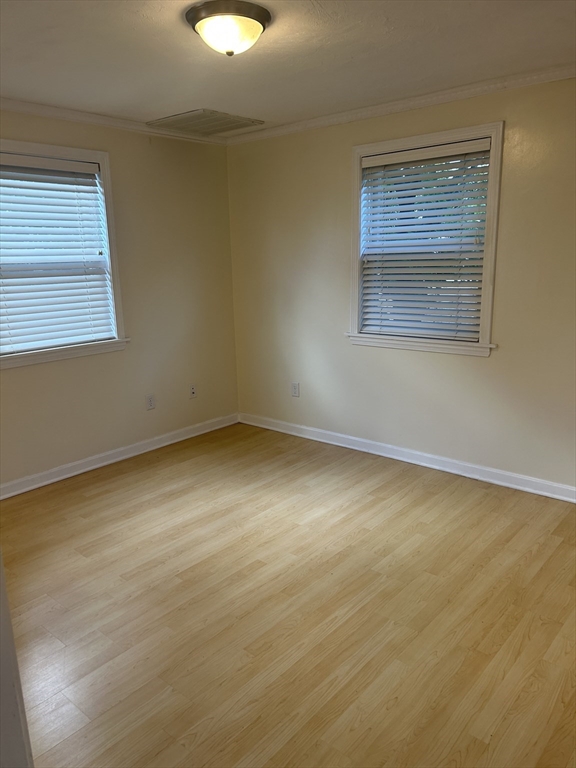 36 Hunting Street, Unit 2 Cambridge, MA 02141 - Photo 8 of 19 an empty room with a window